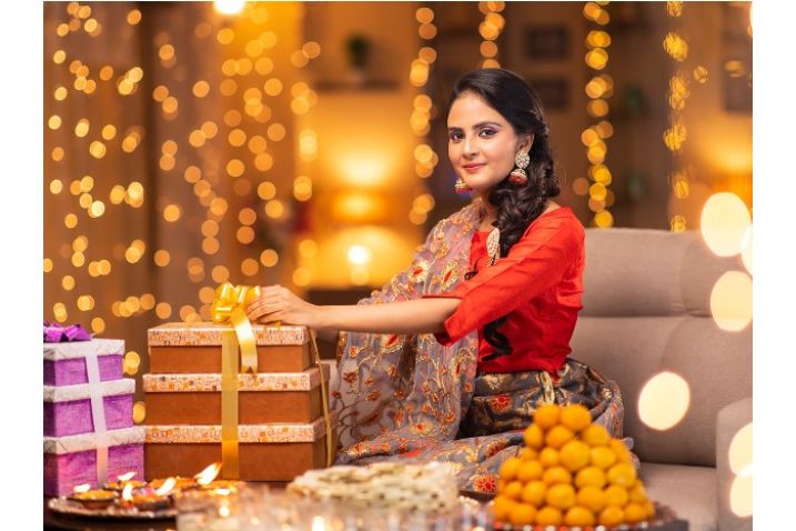 picture showing that girl with diwali sweets